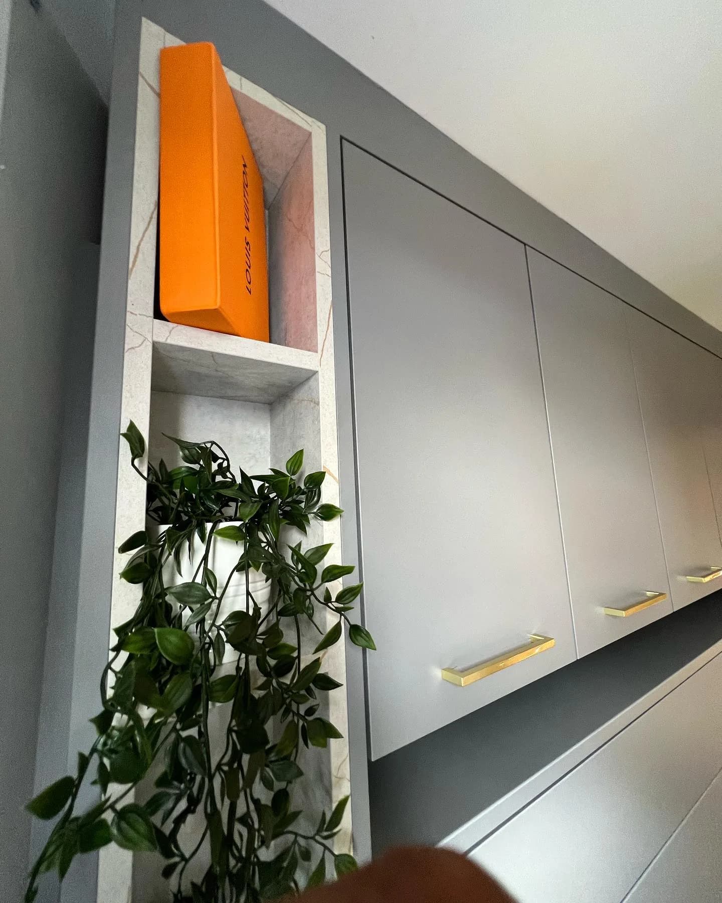 Marble-effect display niche detail in bespoke joinery