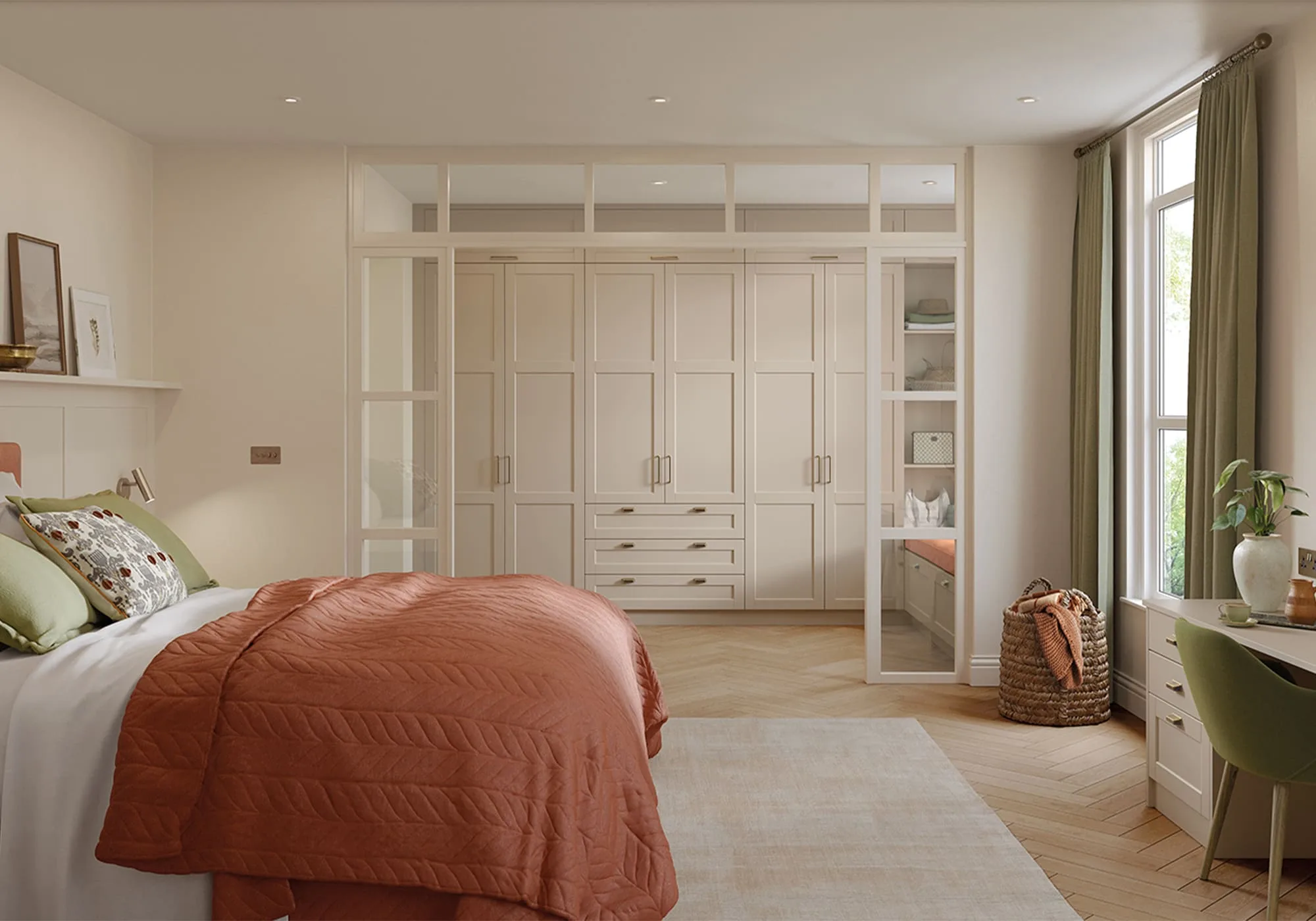 Cream fitted wardrobes around a bedroom with orange bedding