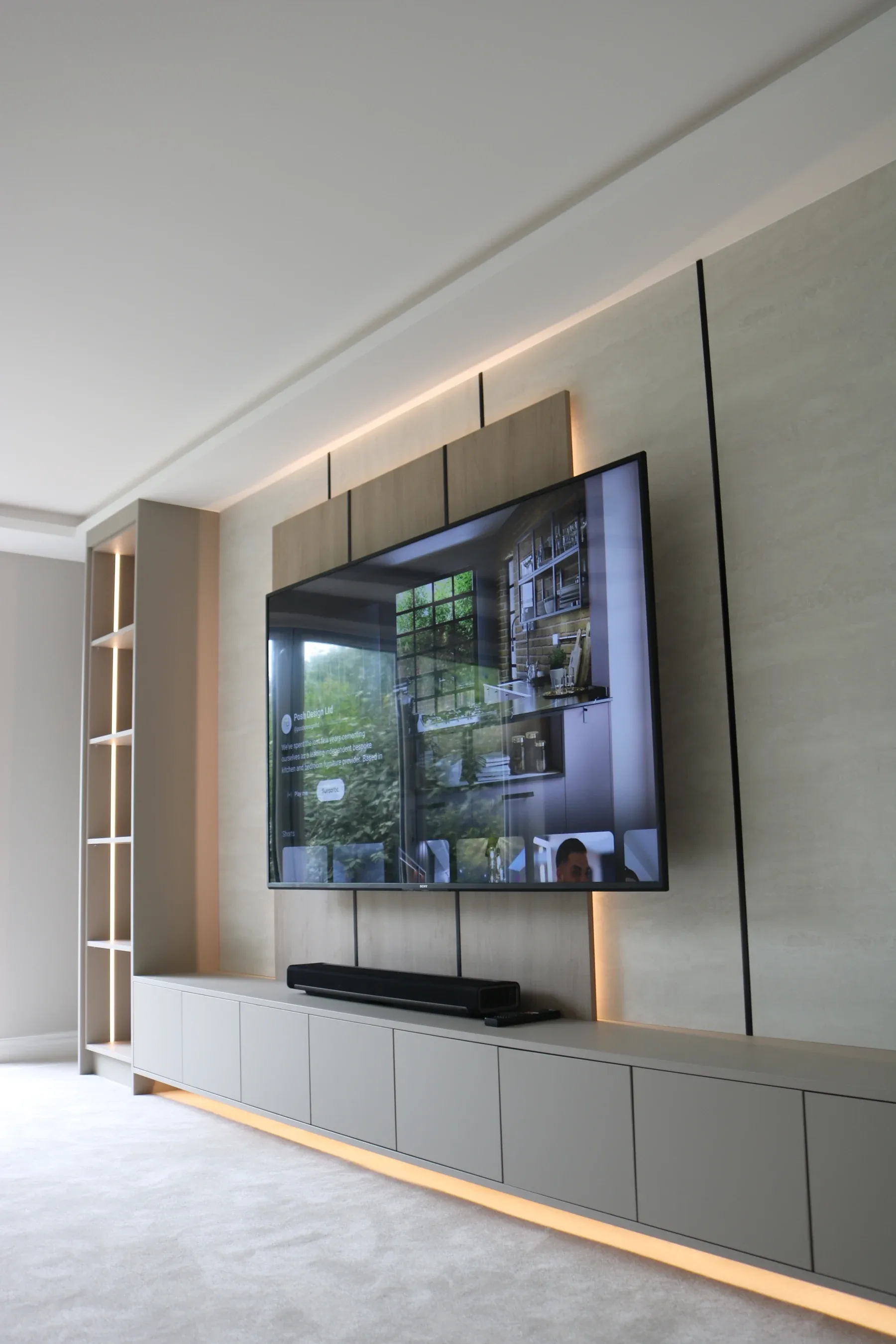 Floating media wall in oak with LED underglow and concealed cabling, real installation