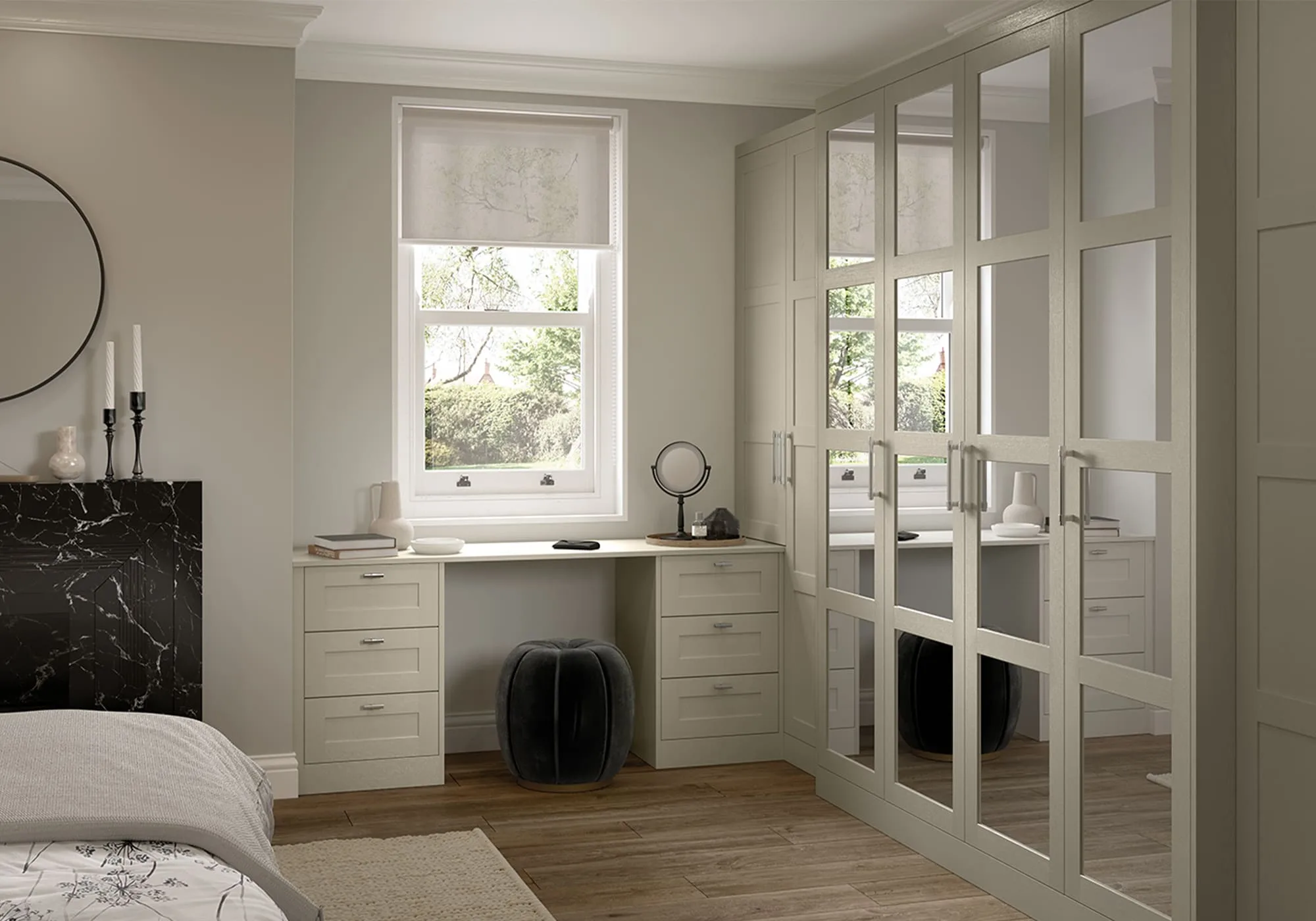 Bedroom with mirrored panel wardrobes and desk